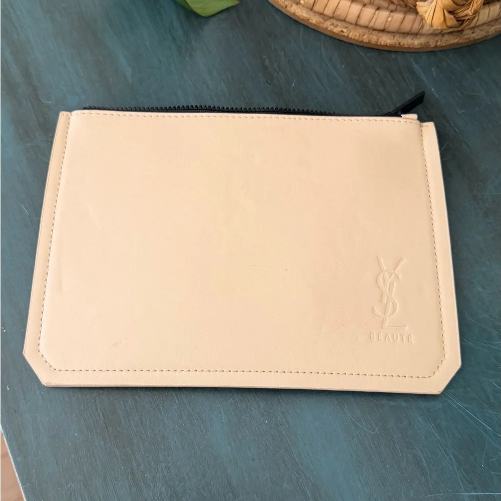 Yves Saint Laurent Beaute beige non leather cosmetic pouch.